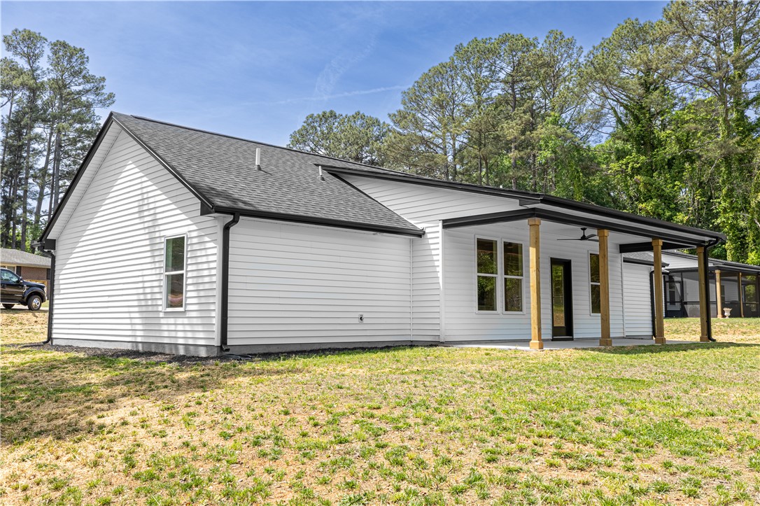 105 Leon Drive Anderson, SC 29621 - Photo 5 of 46 This newly constructed home features a modern design with white siding and a covered patio for outdoor enjoyment.