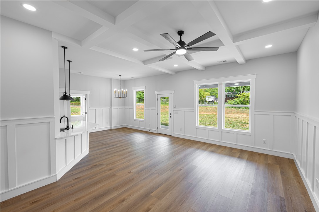 105 Leon Drive Anderson, SC 29621 - Photo 7 of 46 Bright and airy open-concept living space with sleek flooring and elegant lighting.
