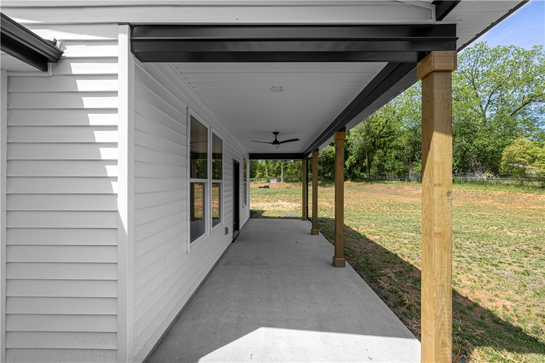 105 Leon Drive Anderson, SC 29621 - Photo 10 of 46 This inviting covered patio extends to a spacious yard, offering tranquil outdoor living.