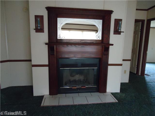 4375 Ellisboro Road Stokesdale, NC 27357 - Photo 5 of 14 Living Room. Relax by your Cozy Fireplace