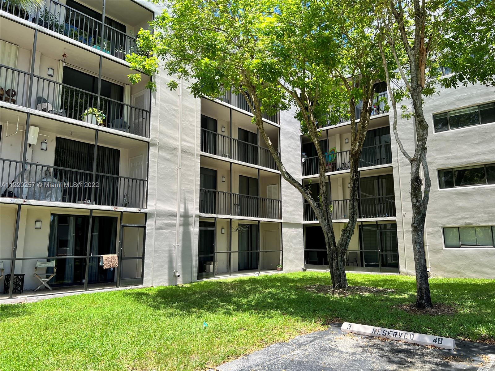 8500 Southwest 133rd Avenue Road, Unit 116 Miami, FL 33183 - Photo 1 of 15 a view of an house with backyard space and balcony