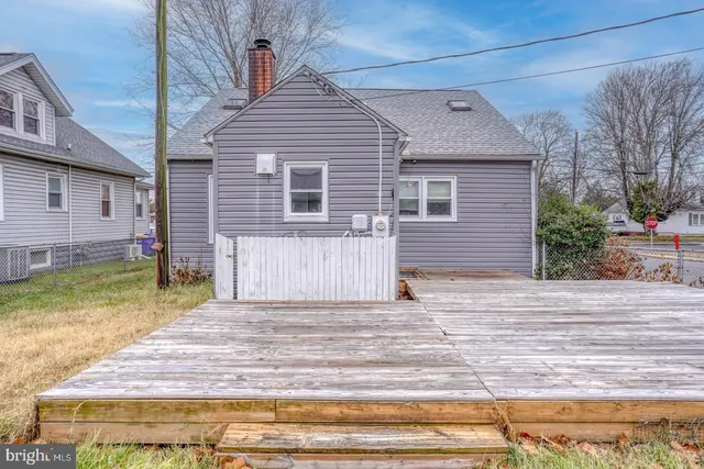 a front view of house with a garden