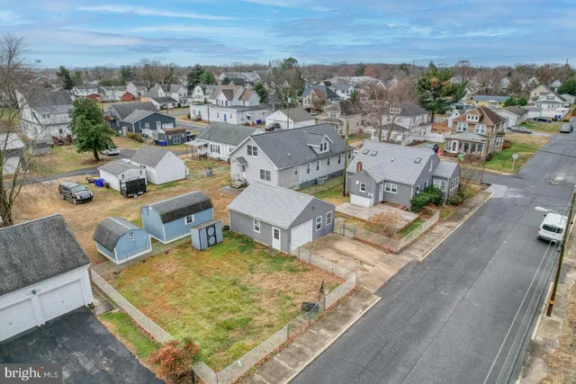 an aerial view of a house with swimming pool and ocean view