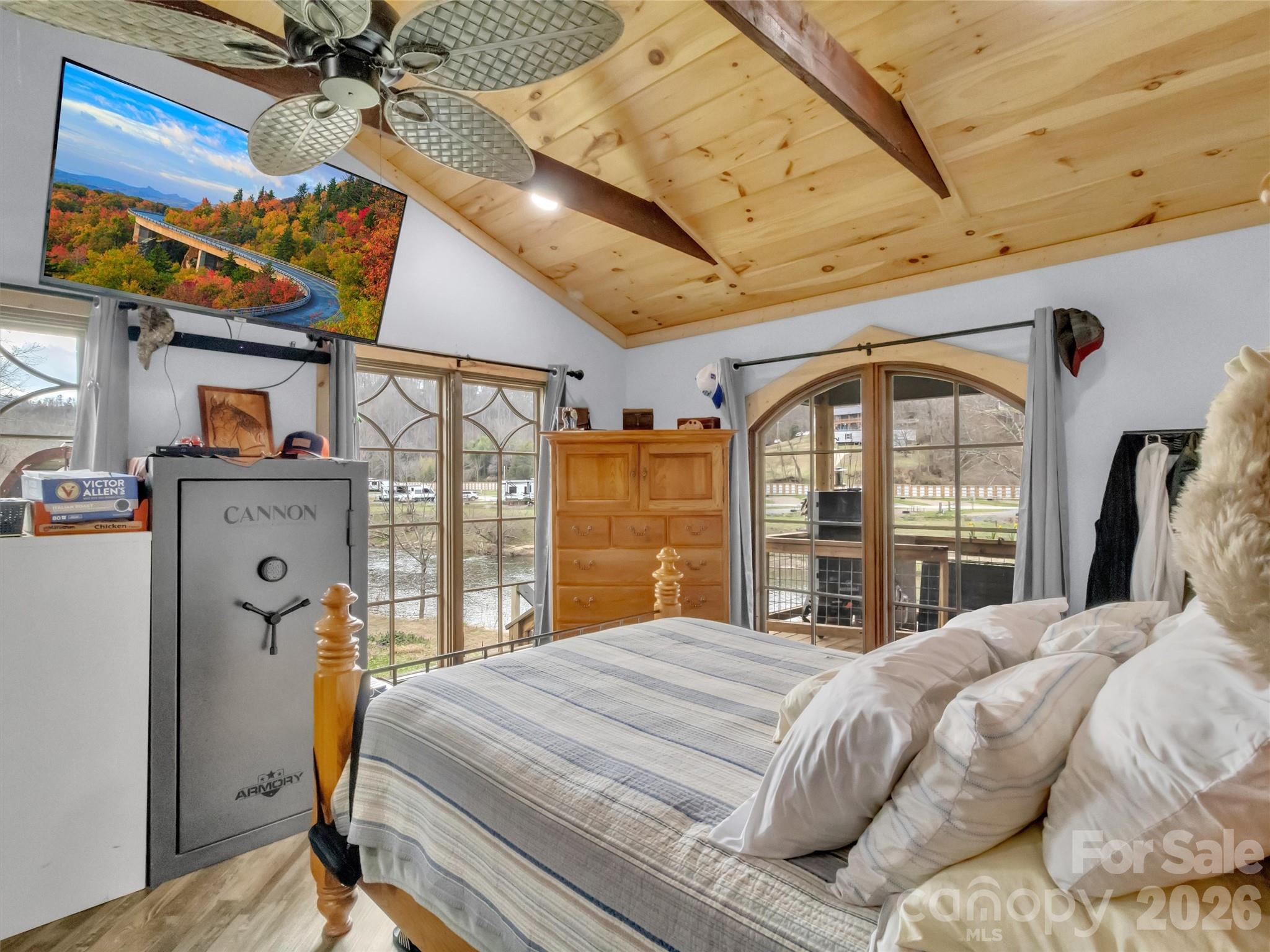 522 North River Road Sylva, NC 28779 - Photo 10 of 39 a bedroom with a bed and a large window