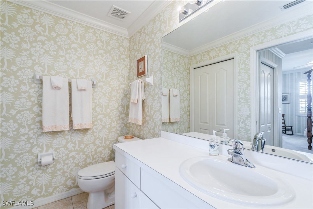 14051 Brant Point Circle, Unit 8105 Fort Myers, FL 33919 - Photo 15 of 33 a bathroom with a sink toilet and mirror