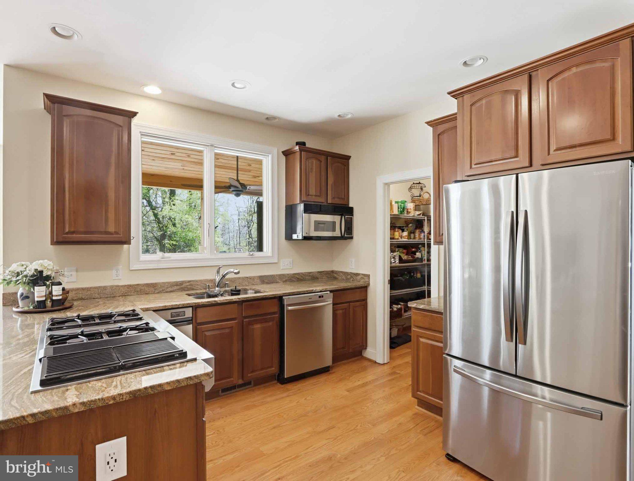 311 Riverdale Road Severna Park, MD 21146 - Photo 21 of 65 Modern kitchen with warm wood accents.