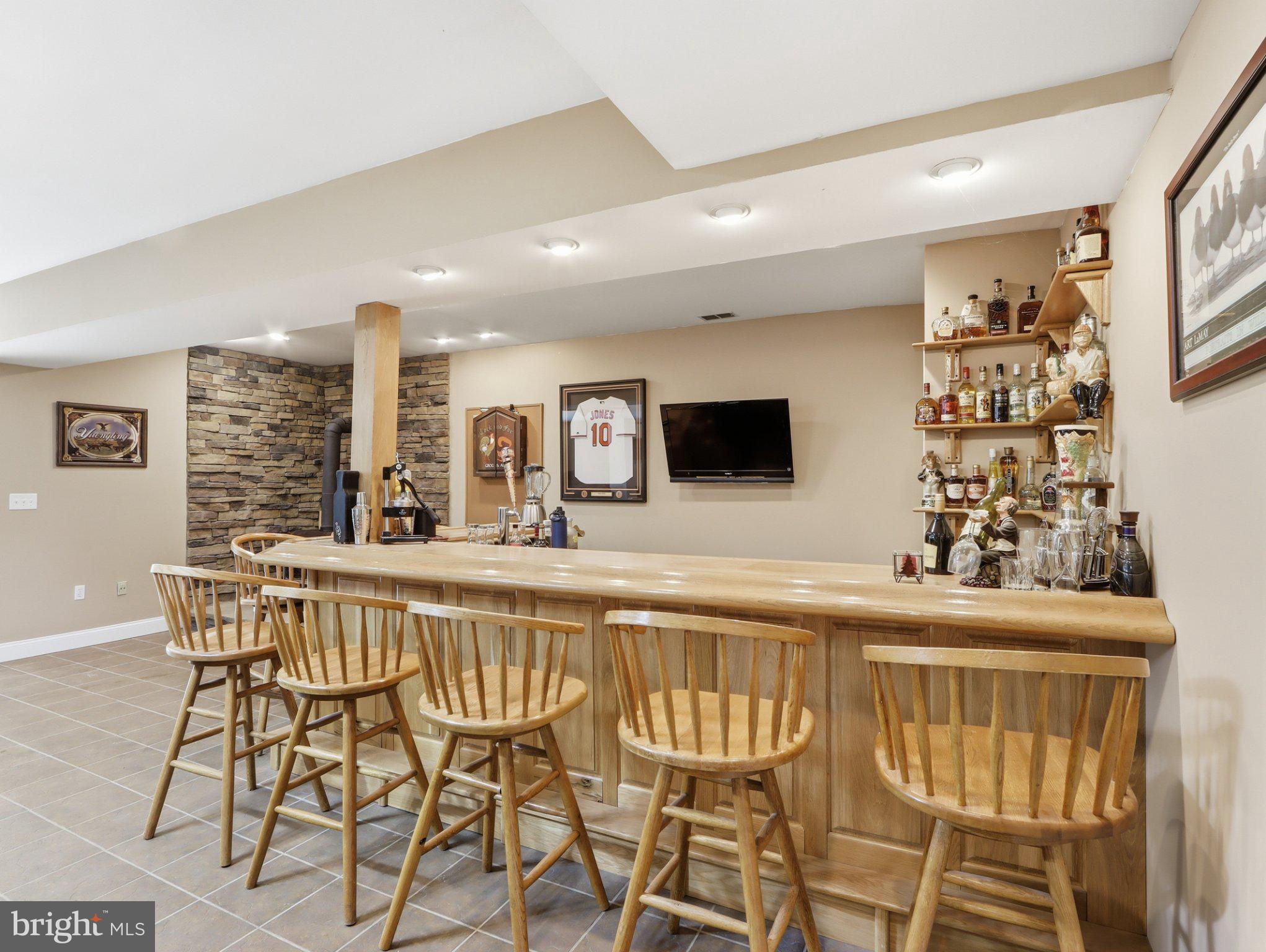 311 Riverdale Road Severna Park, MD 21146 - Photo 48 of 65 Inviting home bar with rustic charm.