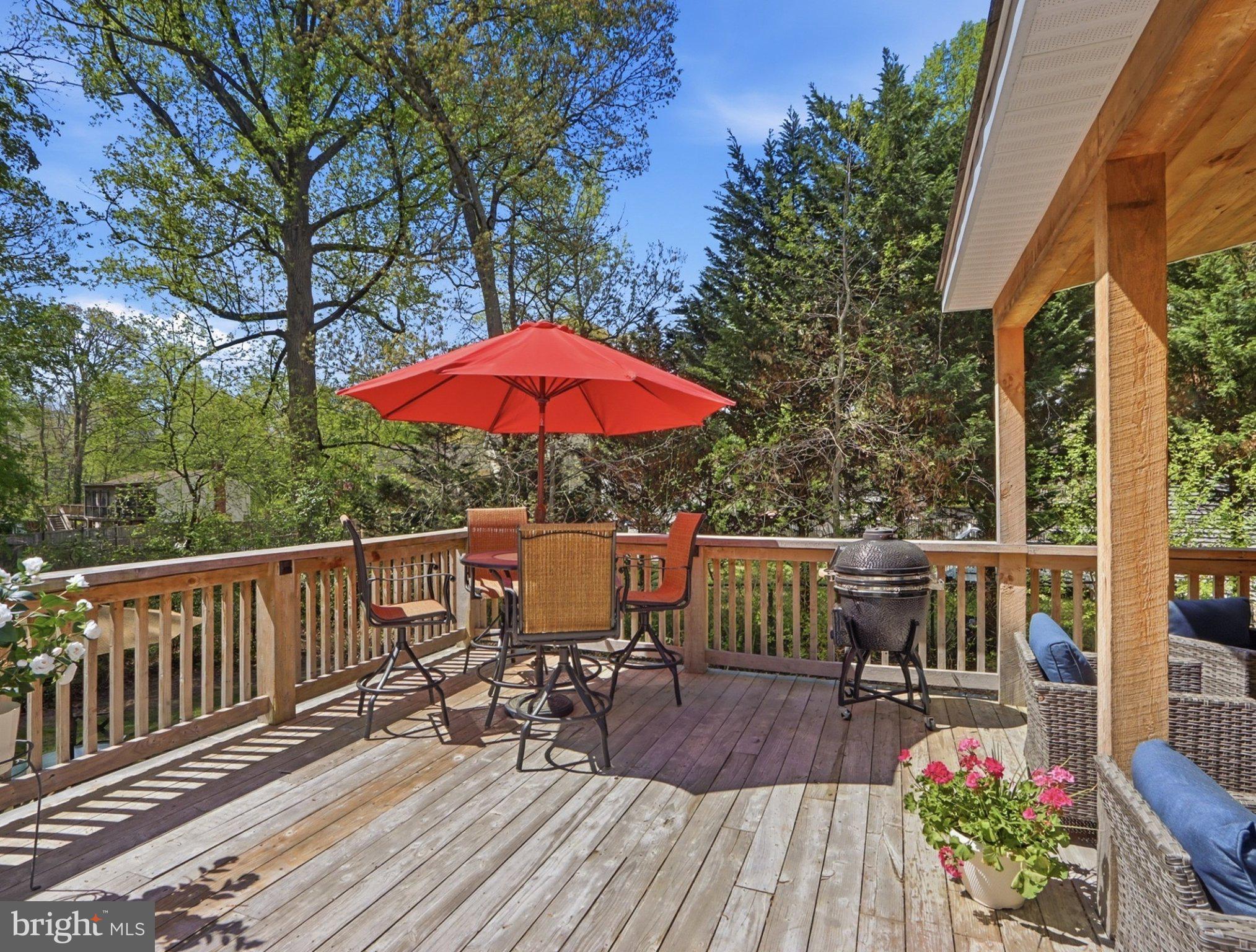 311 Riverdale Road Severna Park, MD 21146 - Photo 61 of 65 Sunny deck with vibrant red umbrella.