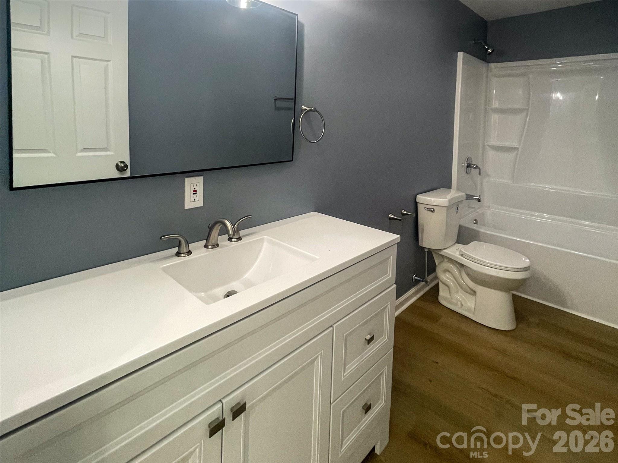 433 Clinton Avenue Lancaster, SC 29720 - Photo 13 of 28 a bathroom with a sink a toilet and shower
