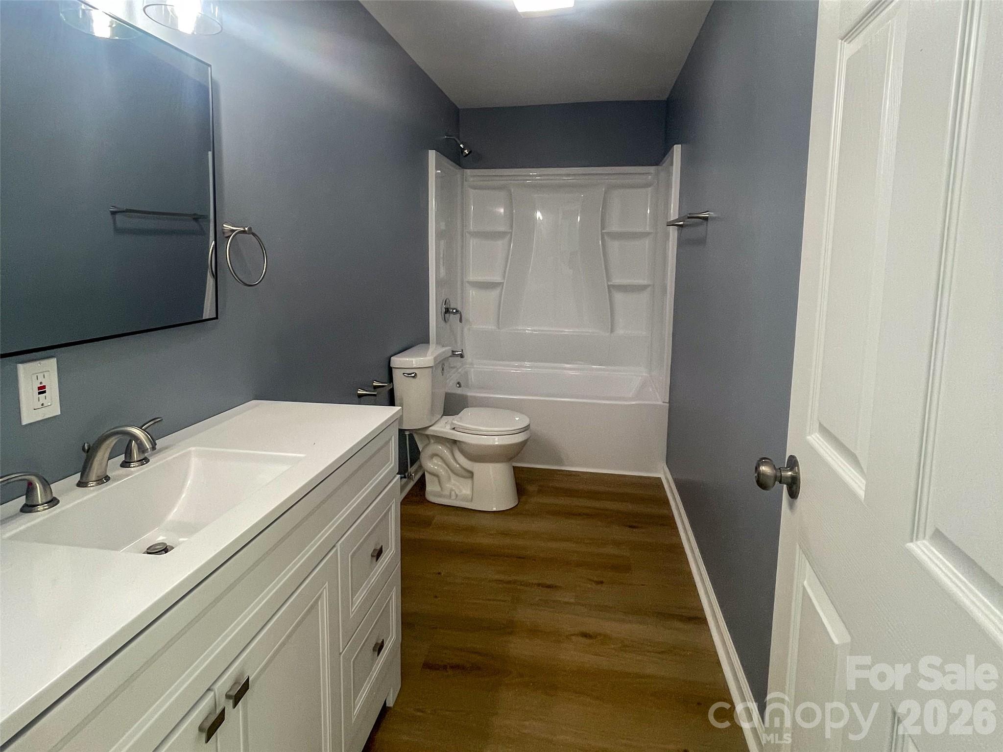 433 Clinton Avenue Lancaster, SC 29720 - Photo 14 of 28 a bathroom with a sink a toilet and shower