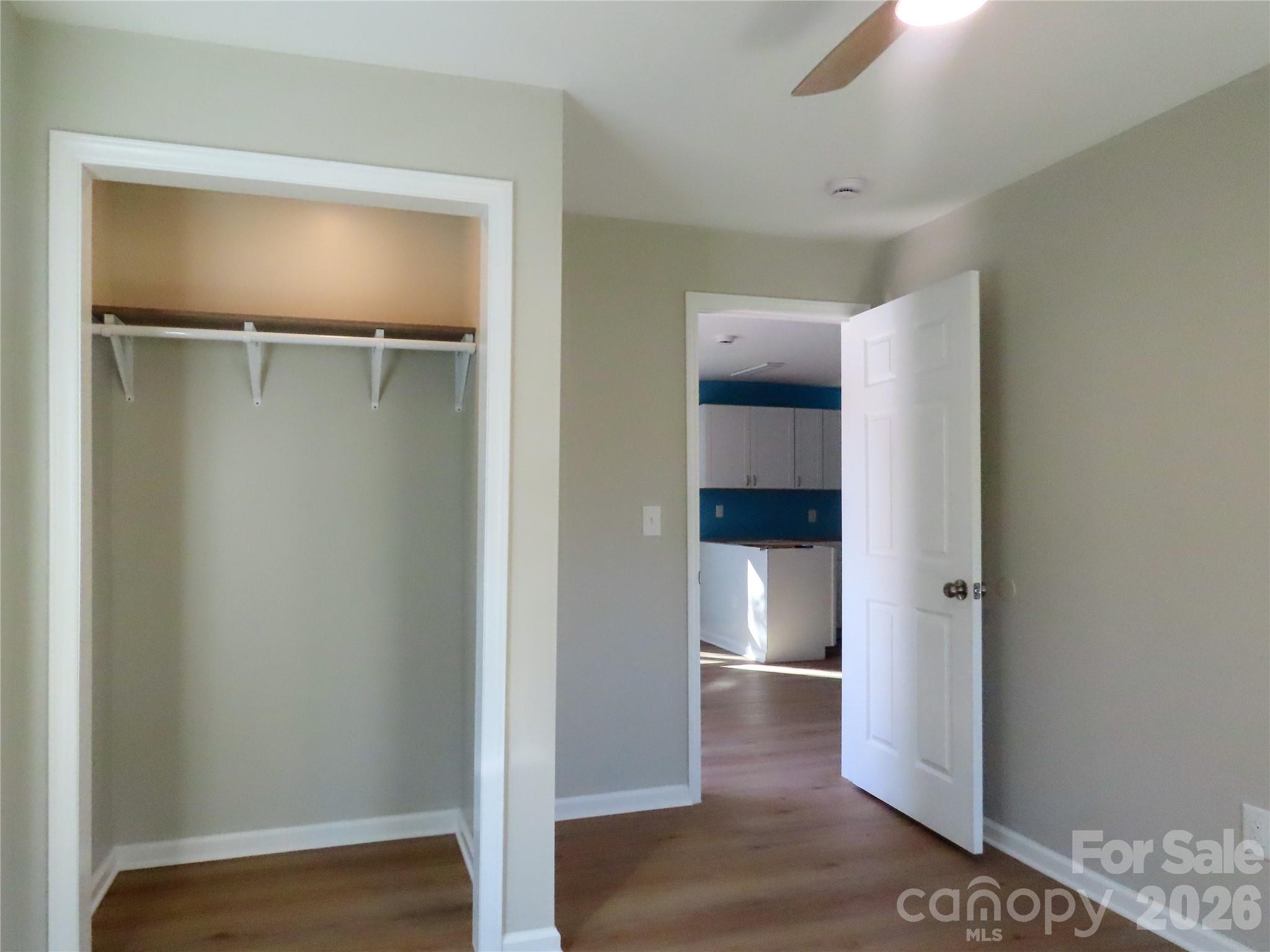 433 Clinton Avenue Lancaster, SC 29720 - Photo 15 of 28 a view of an empty room with wooden floor and closet