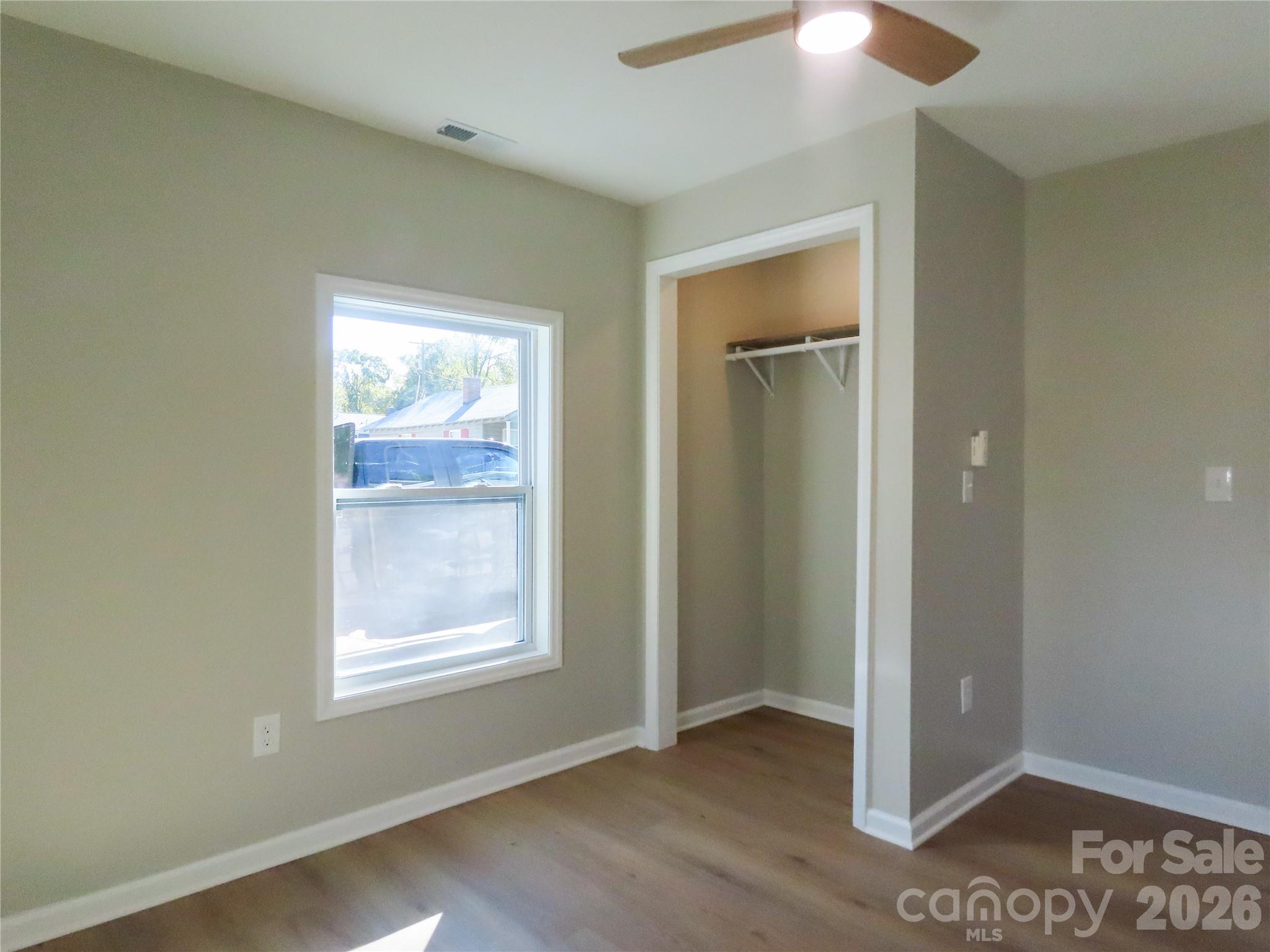 433 Clinton Avenue Lancaster, SC 29720 - Photo 16 of 28 an empty room with windows and closet