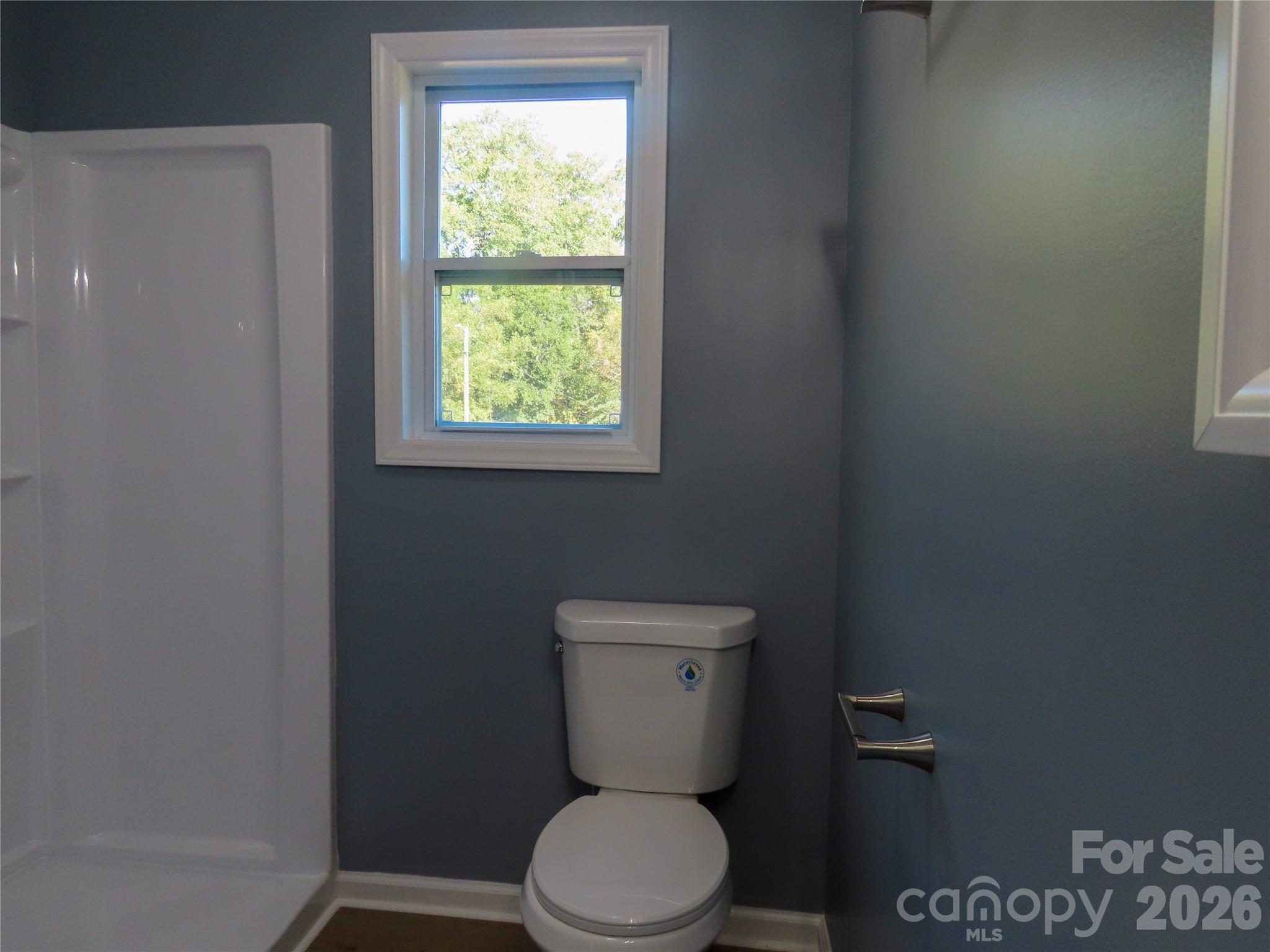 433 Clinton Avenue Lancaster, SC 29720 - Photo 27 of 28 a white toilet sitting next to a window
