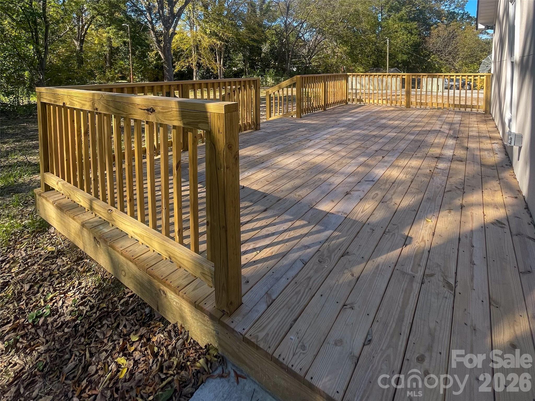433 Clinton Avenue Lancaster, SC 29720 - Photo 5 of 28 a view of deck with wooden floor and fence