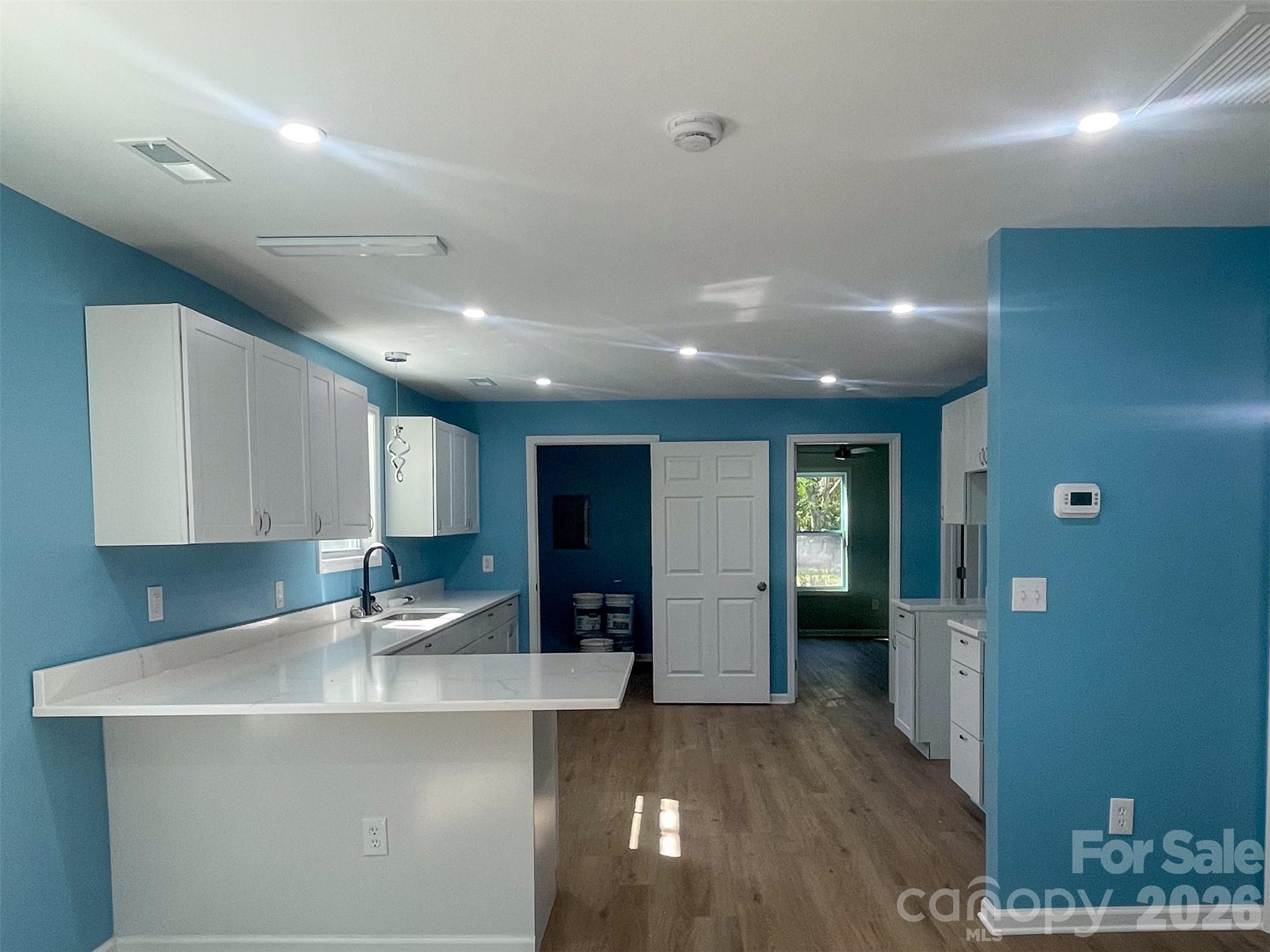 433 Clinton Avenue Lancaster, SC 29720 - Photo 8 of 28 a kitchen with stainless steel appliances granite countertop a sink and a refrigerator