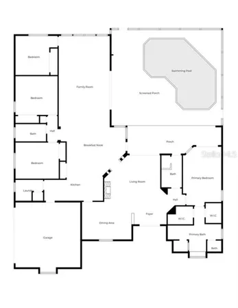 an aerial view of a house with a garden and lake view