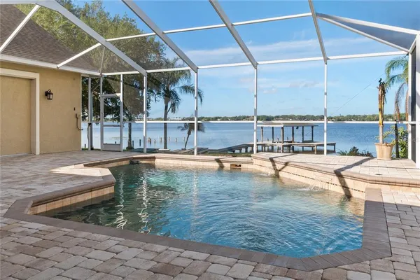a view of a swimming pool with a lounge chairs