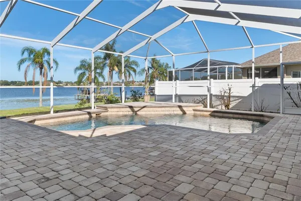 a view of a swimming pool with a lounge chairs
