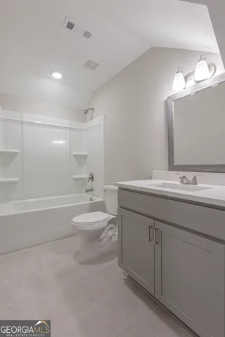 a bathroom with a sink a toilet and a bathtub