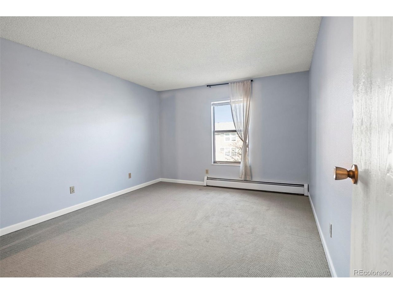 10150 East Virginia Avenue, Unit 2 Denver, CO 80247 - Photo 11 of 20 a view of an empty room with a window