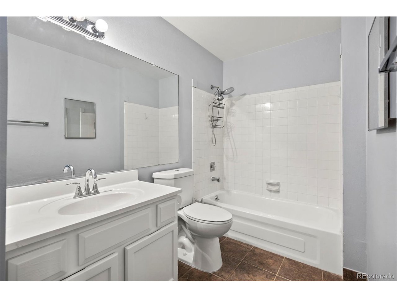 10150 East Virginia Avenue, Unit 2 Denver, CO 80247 - Photo 14 of 20 a bathroom with a sink toilet tub and shower