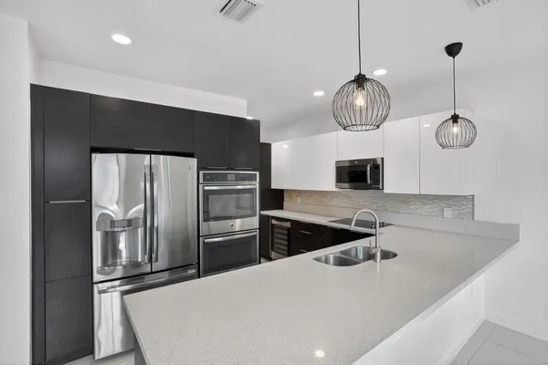 a view of an empty room with glass door