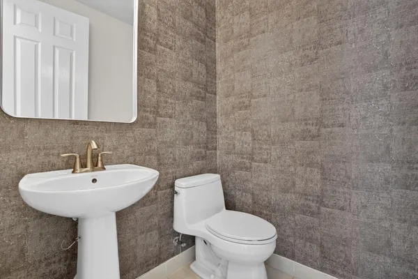 a bedroom with a large bed and a flat screen tv