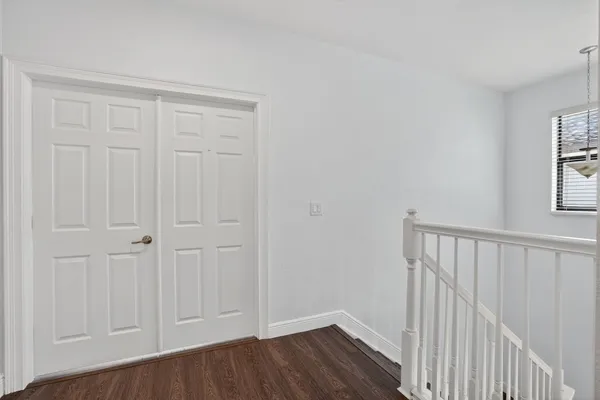 a bathroom with a tub a sink and mirror