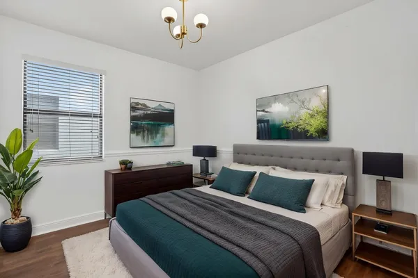 a view of a room with wooden floor and windows