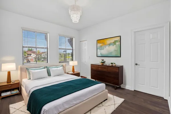 a bathroom with a sink toilet a mirror and shower