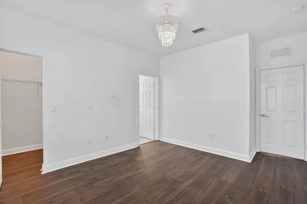 a view of backyard with wooden fence