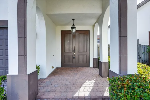 a view of a hallway with a chandelier