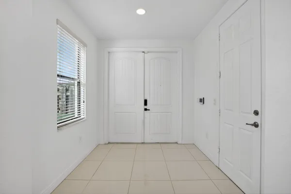 a view of an entryway with wooden floor
