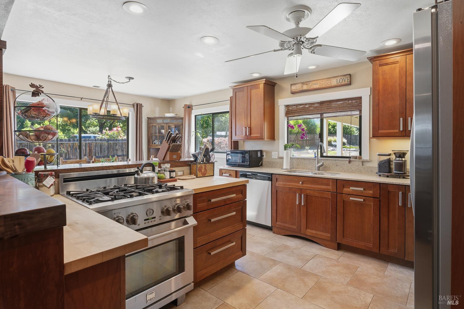 2260 Old River Road Ukiah, CA 95482 - Photo 16 of 29 a kitchen with stainless steel appliances granite countertop a stove a sink and a refrigerator