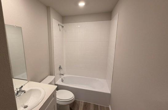 232 Blanco Drive Azle, TX 76020 - Photo 3 of 11 a bathroom with a granite countertop bathtub shower sink mirror vanity and toilet