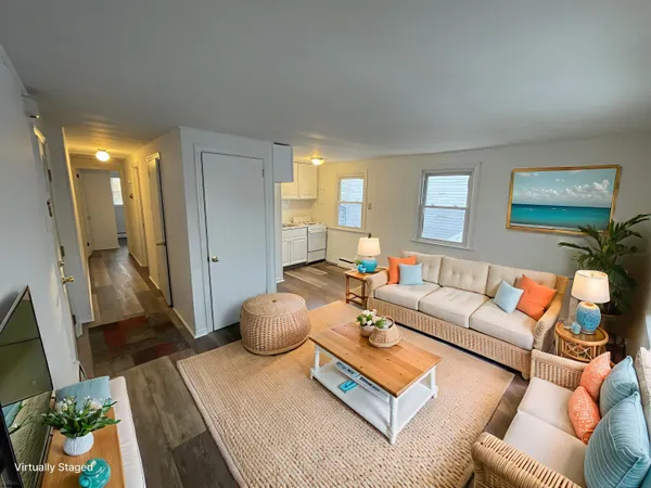 a living room with furniture and a rug