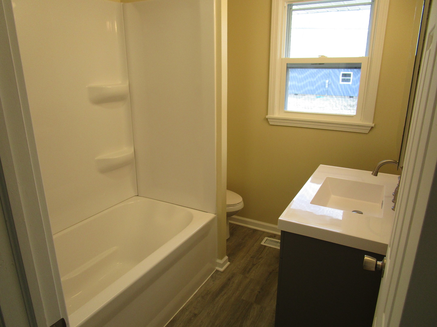 306 Grant Street Harvard, IL 60033 - Photo 12 of 14 a bathroom with a sink and a bathtub