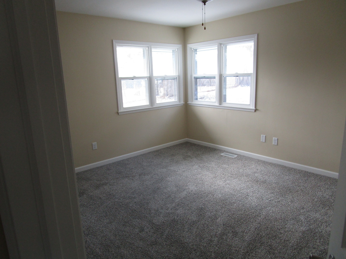 306 Grant Street Harvard, IL 60033 - Photo 10 of 14 an empty room with windows
