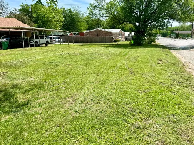 a backyard of a house with lots of green space