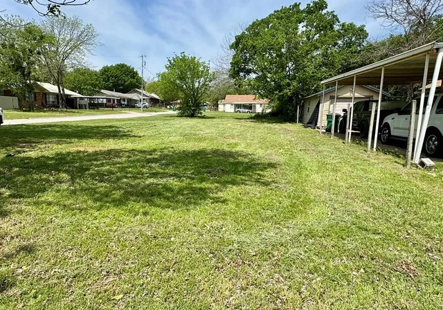 a view of a yard with an outdoor space