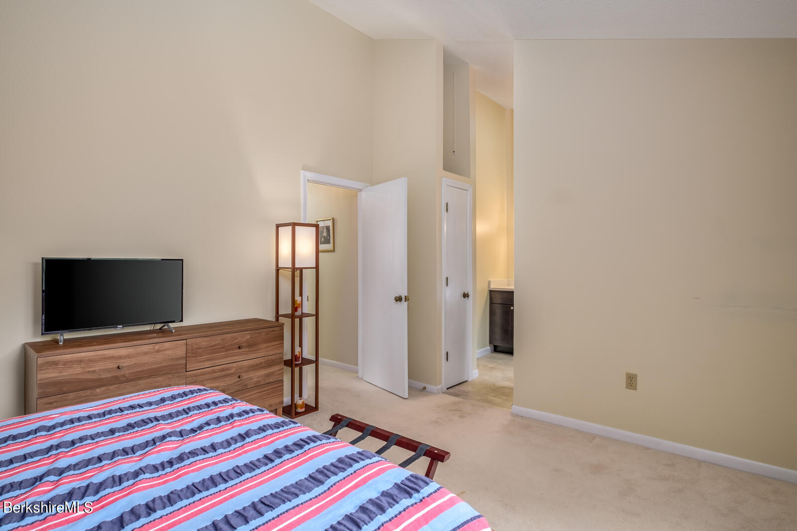 126 South Hemlock Lane Williamstown, MA 01267 - Photo 15 of 24 a bedroom with a bed and a flat screen tv