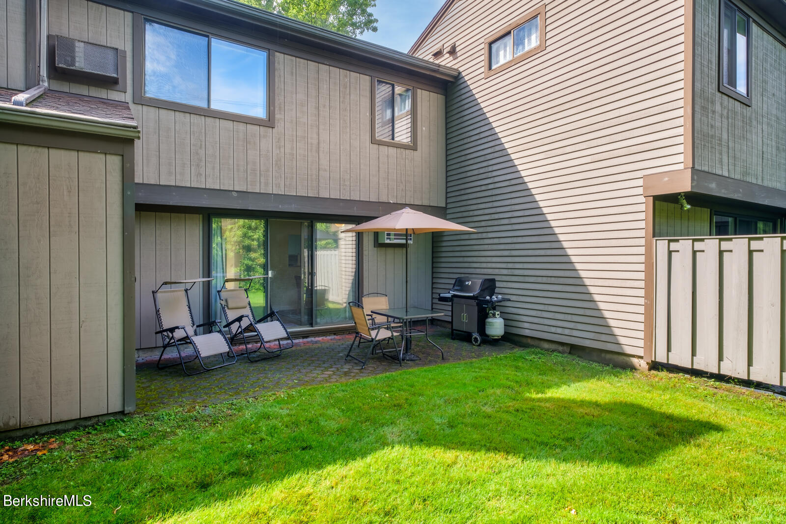 126 South Hemlock Lane Williamstown, MA 01267 - Photo 21 of 24 a view of a house with backyard sitting area and garden