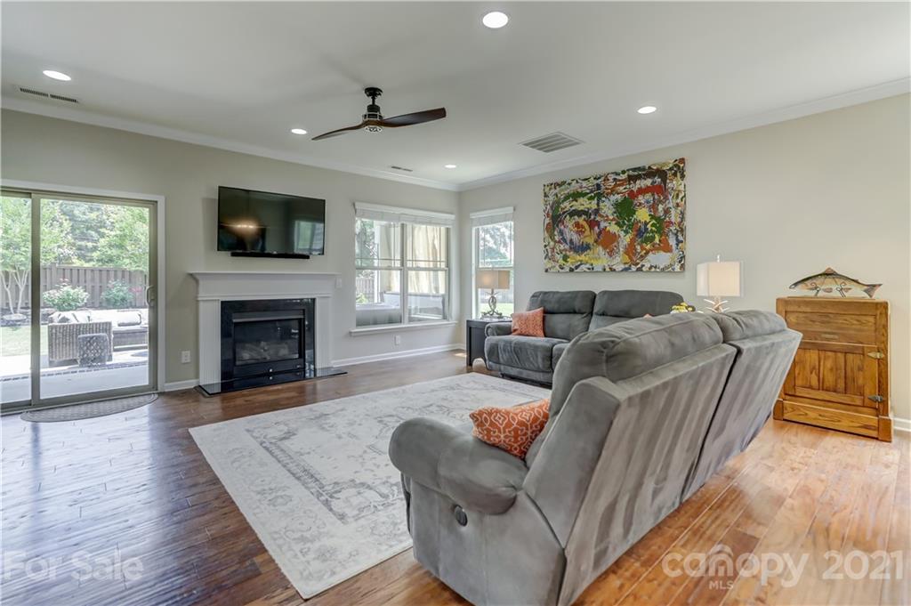 5202 Waterloo Drive Tega Cay, SC 29708 - Photo 14 of 44 a living room with furniture fireplace and flat screen tv