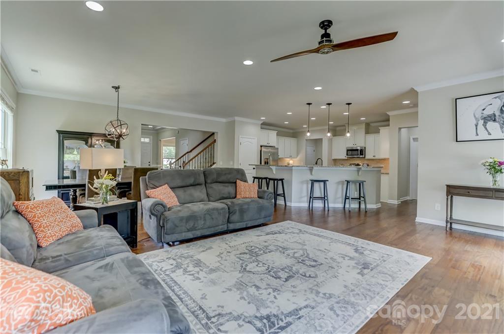 5202 Waterloo Drive Tega Cay, SC 29708 - Photo 15 of 44 a living room with furniture and kitchen view