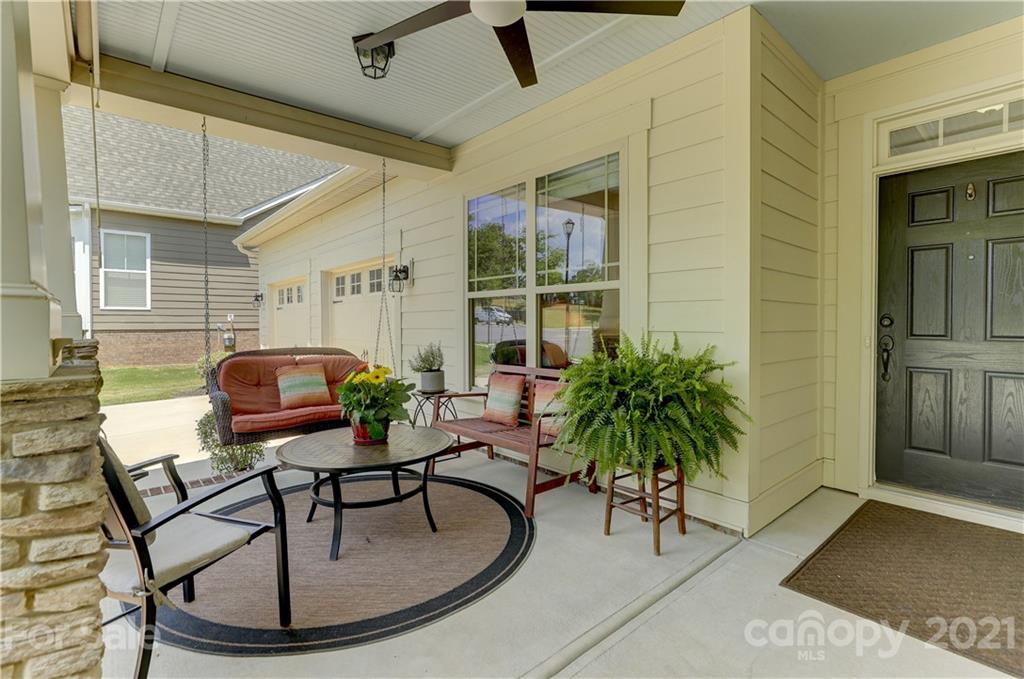 5202 Waterloo Drive Tega Cay, SC 29708 - Photo 3 of 44 a swimming pool with outdoor seating