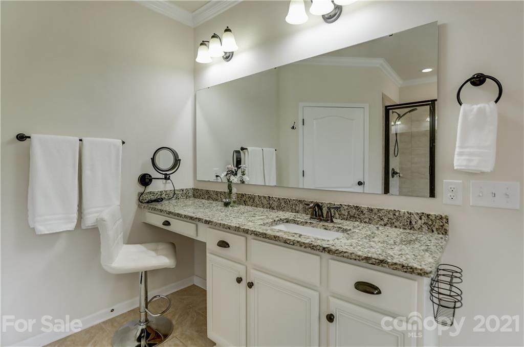 5202 Waterloo Drive Tega Cay, SC 29708 - Photo 25 of 44 a bathroom with a granite countertop sink and a mirror