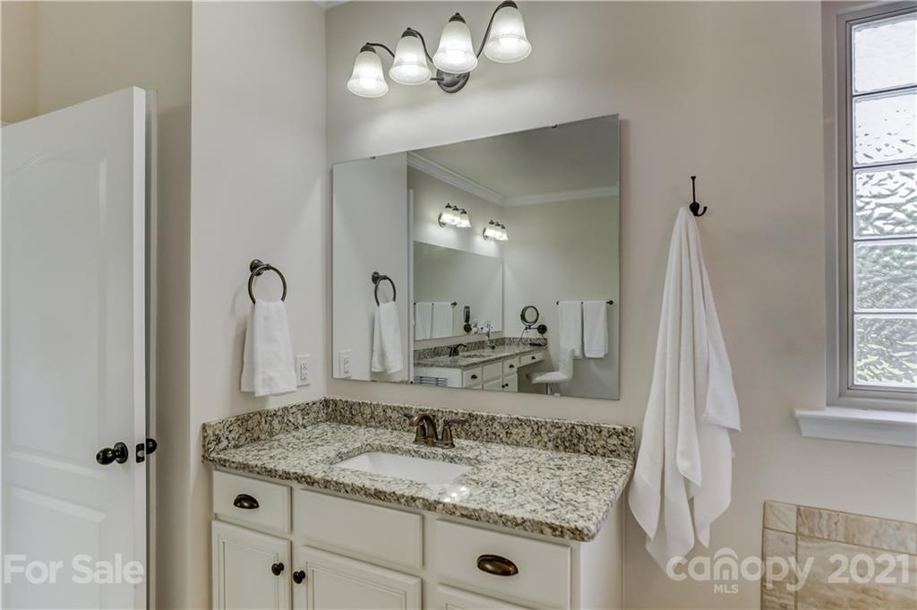 5202 Waterloo Drive Tega Cay, SC 29708 - Photo 26 of 44 a bathroom with a granite countertop sink and a mirror