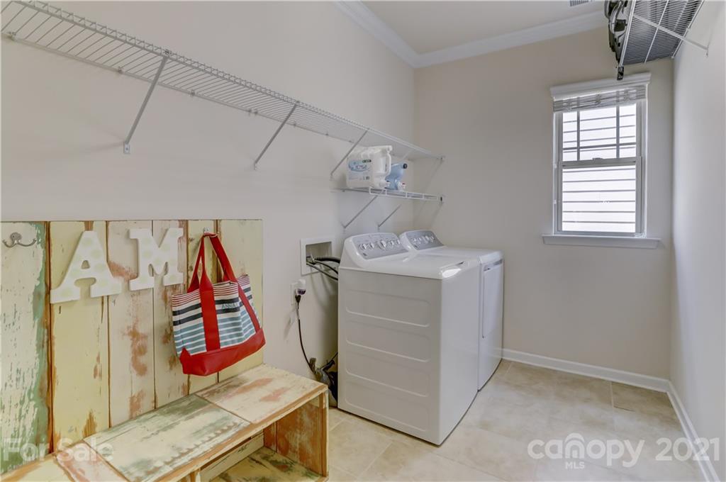 5202 Waterloo Drive Tega Cay, SC 29708 - Photo 29 of 44 a utility room with dryer and washer