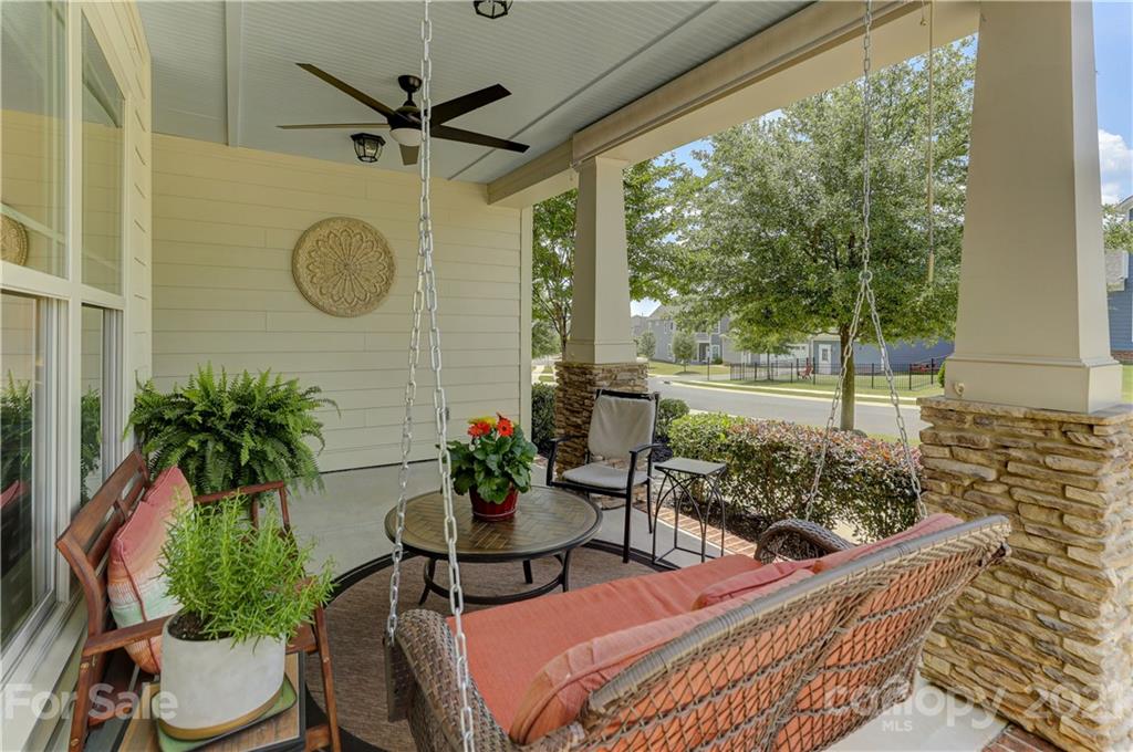 5202 Waterloo Drive Tega Cay, SC 29708 - Photo 4 of 44 a view of a house with a porch and furniture