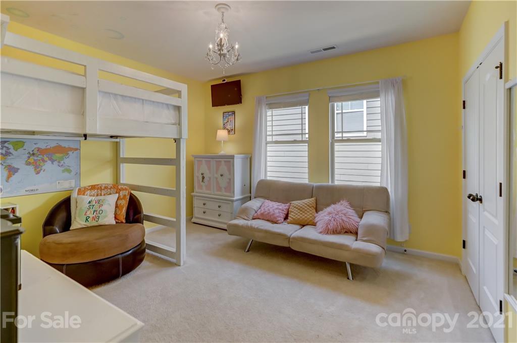 5202 Waterloo Drive Tega Cay, SC 29708 - Photo 32 of 44 a living room with furniture and a window
